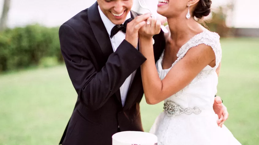 Couple cutting cake