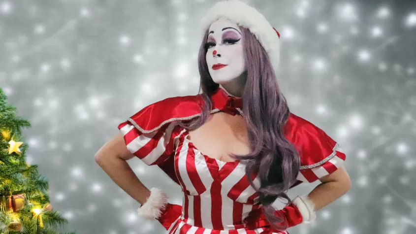 A woman dressed as a clown