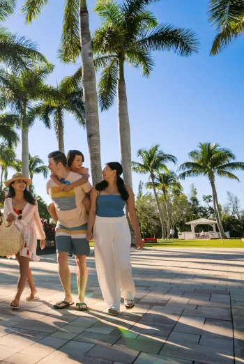 family walking outside at hyatt regency coconut point resort